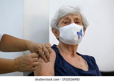 Sao Paulo, SP, Brazil - February 5, 2021: A Nurse Gives A Shot Of COVID-19 CoronaVac Vaccine To An Elderly Woman During A Priority Vaccination Program For People With More Than 90 Years Old.