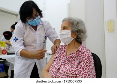 Sao Paulo, SP, Brazil - February 5, 2021: A Nurse Gives A Shot Of COVID-19 CoronaVac Vaccine To An Elderly Woman During A Priority Vaccination Program For People With More Than 90 Years Old.