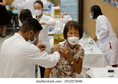 Sao Paulo, SP, Brazil - February 9, 2021: A Nurse Gives A Shot Of COVID-19 Vaccine To An Asian Woman During A Priority Vaccination Program For Elderly People.