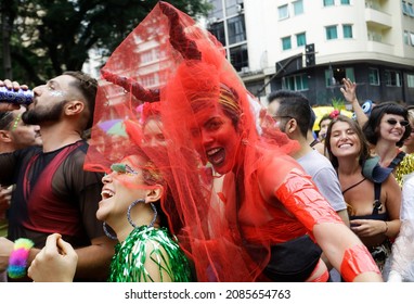 Sao Paulo, SP, Brazil - February 22, 2020: Revelers Wearing Costumes Sing And Dance During The Tarado Ni Voce Carnival Block Party In SP Downtown Streets.