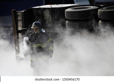 Sao Paulo, SP / Brazil - July 17, 2012: A Firefighter Works In An Accident With A Truck Transporting Liquid Nitrogen.