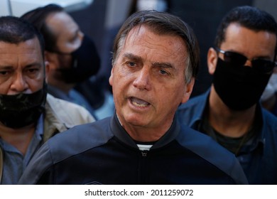 Sao Paulo, SP, Brazil - July 18, 2021: Brazil's President Jair Bolsonaro speaks to reporters as he leaves the hospital after recovering from an intestinal obstruction.