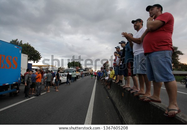 Sao Paulo, SP / Brazil - July 31, 2012: Truck\
drivers stand at a big traffic jam in Presidente Dutra highway\
during a truckers strike.