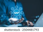 SAP System Application Products. Business process automation and management software concept. Businessman presents SAP related technology icons, business process automation, and management solutions.