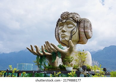 Sapa, Vietnam. - July13:2022.Statue Of A Woman On The Cliff.