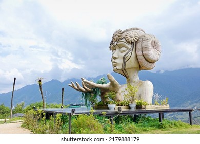 Sapa, Vietnam. - July13:2022.Statue Of A Woman On The Cliff.