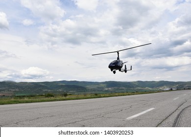 Sapareva Banya, Bulgaria - May 12, 2019: Small helicopter - tandem autogyro - landing on the runway of Sapareva Banya Airport