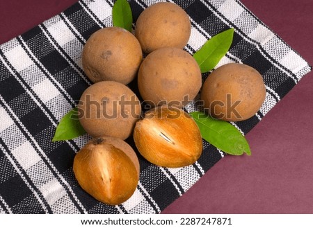 Sapodilla fruit (Manilkara zapota) and other names such as sapota, chikoo, chico, naseberry, or nispero. Sapodilla is tropical fruit evergreen tree and sweet taste fruit