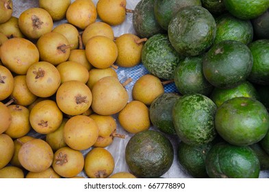 Sapodilla And Green Orange Fruits,they Have Benefit Food,much Cellulose,  In The Fresh Market.