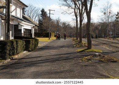 Sapporo Japan, people walking around outdoor in the Historical Village Of Hokkaido between the old buildings and houses of the open air museum in winter at daytime in Japan. - Powered by Shutterstock