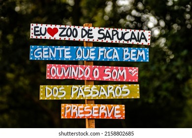 SAPUCAIA, BRAZIL - Jul 04, 2021: A Closeup Shot Of The Sign On In Sapucaia Zoo With Text Zebra, Monkeys, Birds And Ducks In Brazil