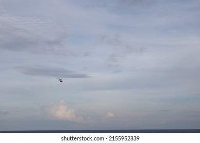Sapudi, May 2022. Chopper landing on the helideck of Oil rig, which functions for offshore drilling on offshore oil drilling platforms. for oil and gas exploration on the seabed. helicopter on helipad