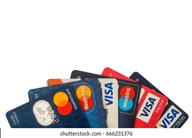 Sarajevo, Bosnia and Herzegovina - Jun 25, 2017: closeup pile of credit cards, Visa and MasterCard, credit, debit and electronic. Isolated on white background with clipping path. Design element.