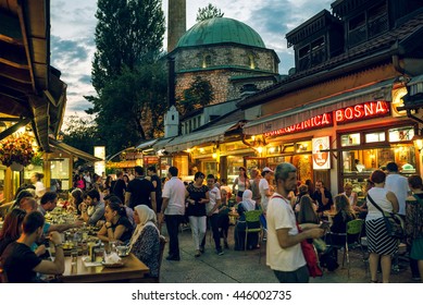SARAJEVO, BOSNIA AND HERZEGOVINA - JUNE 30, 2016: People having iftar dinner on streets of Sarajevo, Bosnia, during holy muslim month of Ramadan. Toned image.