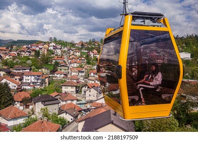 Sarajevo, Bosnia - May 2, 2022 - Woman looks out over Sarajevo from cable car