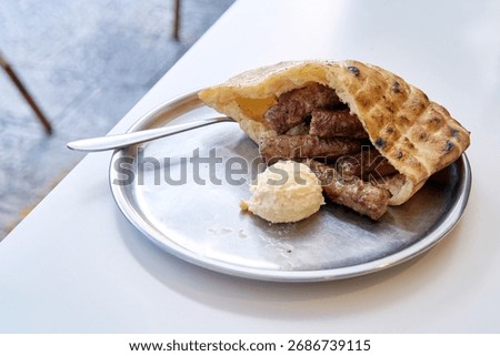 Sarajevo-style cevapi (Sarajevski cevapi). Grilled dish of minced meat found traditionally in the Balkans.