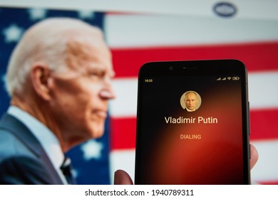 SARANSK, RUSSIA - MARCH 22, 2021: The Smartphone With Vladimir Putin Contact Seen On It's Screen And Joe Biden Seen On The Background.