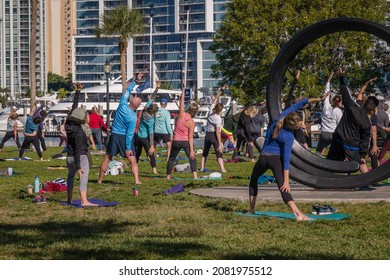 Sarasota, FL, US-November 27, 2021: Large Outdoor Yoga Class In Bayfront Park Near Marina And Water.