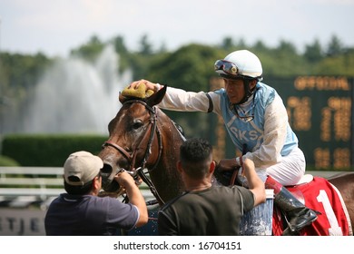 SARATOGA SPRINGS - August 18: Edgar S. Prado Cools Off Law N Dora Before Entering The Winners Circle After The Fourth Race  August 18, 2008 In Saratoga Springs, NY