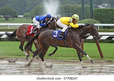 SARATOGA SPRINGS - JUL 23: Jockey Edgar Prado Guides Silvislip To Her First Win, Passing Calvin Borel And Playing Pirates, At Saratog Race Course On Jul 23, 2010 In Saratoga Springs, NY.