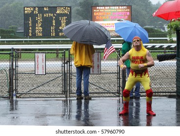 SARATOGA SPRINGS - JUL 23: An Opening Day Downpour Does Not Dampen The Spirits Of Some Horse Racing Fans At Saratoga Race Course On Jul 23, 2010 In Saratoga Springs, NY.