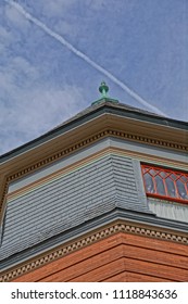 Saratoga Springs, New York/USA- June 22, 2018: A Vertical High Definition Closeup Image Of The Colorful Ornate Tower Of A Historic Iconic Queen Anne Victorian Mansion Turned Into A Hotel.            