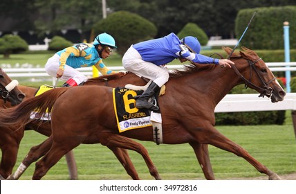 SARATOGA SPRINGS, NY - AUG 8: Flashing (R) Under Jockey Richard Migliore, Wins The Test Stakes At Saratoga Race Course August 8, 2009 In Saratoga Springs, NY.