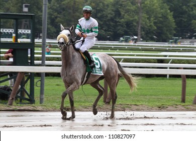 SARATOGA SPRINGS, NY - JULY 28: Jockey Javier Castellano Aboard Winter Memories Is All Smiles After Winning The Diana Stakes On July 28, 2012 Saratoga Springs, New York