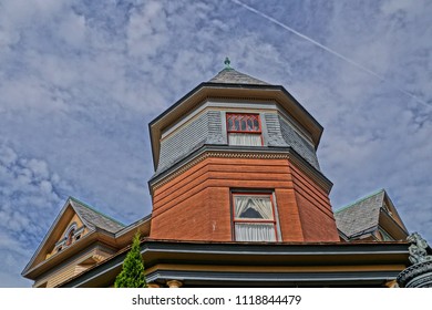 Saratoga Springs, NY/USA- June 22, 2018: A Horizontal High Definition Closeup Image Of The Colorful Ornate Tower Of A Historic Iconic Queen Anne Victorian Mansion Turned Into A Hotel