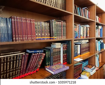 Saratov / Russia - February 25, 2018: Library in the synagogue. Multi-colored books on the bookshelf in the library