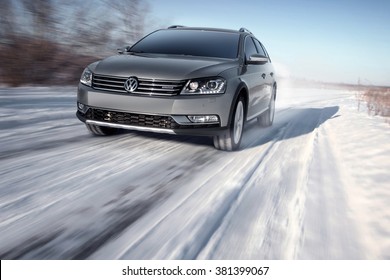 Saratov, Russia - January 26, 2014: Gray Modern Car Volkswagen Passat Alltrack Drive Speed On Road At Winter Daytime