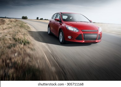 Saratov, Russia - September 21, 2014: Red Car Ford Focus III Sport Fast Speed Driving On The Apshalt Road At Daytime