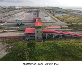 Sarawak, Malaysia – August 1, 2021: The Photo Showing An Aerial View Of Pipe Conveyor Structure For Transporting Bulk Material From Port To Specify Area At Industrial Park Of Malaysia, Southeast Asia.