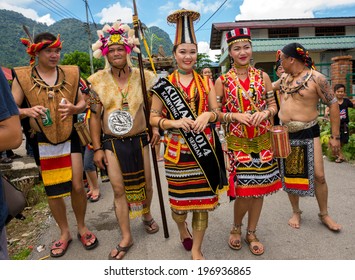 SARAWAK, MALAYSIA: JUNE 1, 2014: People Of The Bidayuh Tribe, An Indigenous Native People Of Borneo, In Traditional Costumes, Take Part In A Street Parade To Celebrate The Gawai Dayak Festival.