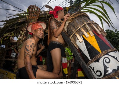 SARAWAK, MALAYSIA: JUNE 1, 2014: Musicians From The Bidayuh Tribe, An Indigenous Native People Of Borneo Plays The Drums In A Street Parade Celebrating Thanksgiving Day, Known As The Gawai Festival.