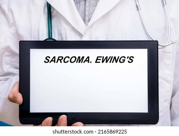 Sarcoma.  Doctor With Rare Or Orphan Disease Text On Tablet Screen Sarcoma