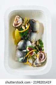 Sardine Rolls With Parsley Caviar. And Citrus. High Restaurant Cuisine In A Plastic Takeout Container