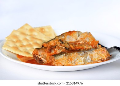 Sardines In Spicy Louisiana Hot Sauce On White Plate With Old-fashioned Saltine Crackers.