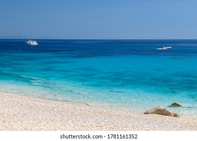 Sardinia, Italy, Holidays. The Beach With White Sand, Sea With Crystal Clear Azure Water. Calm And Tranquility.