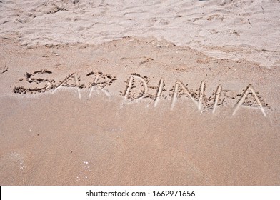 Sardinia Sign Written In Sand On A Famous Beach In Sardinia, Italy.