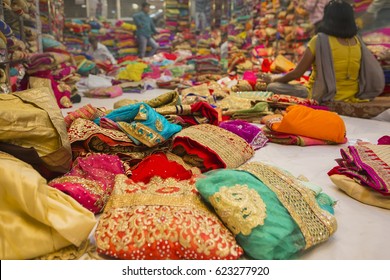 Sari Shop. Indian Traditional Women's Sari Clothing On Market. Buying Wedding Sari In Jaipur. Colorful Beautiful Sari Dresses In The Store. Luxury Oriental Handmade Eastern Fabric 