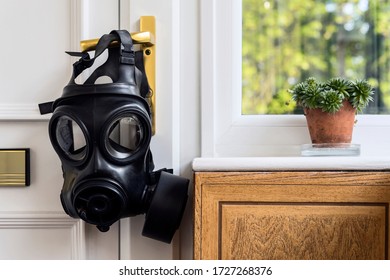 SAS Gas Mask Hanging Off The Entry Door Handle. Home Isolation.