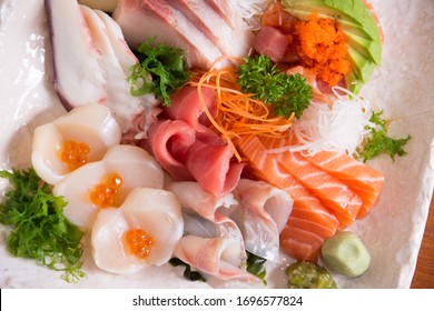 Sashimi. Sashimi (刺身, English: /səˈʃiːmi/ sə-SHEE-mee) is a Japanese delicacy consisting of fresh raw fish or meat sliced into thin pieces and often eaten with soy sauce. 