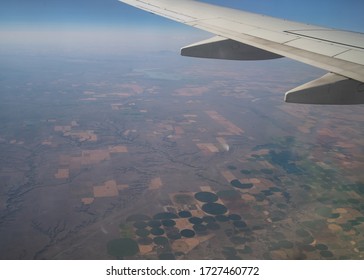 Saskatoon, Saskatchewan / Canada - August 2 2019: Flying Across Canada Over The Prairies. 