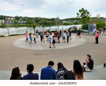 Saskatoon, Saskatchewan/CAN - July 18, 2018. People Having Fun With Salsa Dancing At The Amphitheatre Of River Landing. 