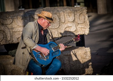 Saskatoon, SK/ Canada - April 27, 2018: Man Playing Blues Guitar Downtown. 