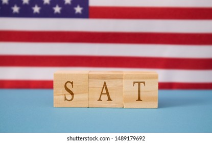 SAT Exam in WOoden blook letters on US flag