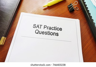 SAT Practice Questions Study Guide On A Desk                              