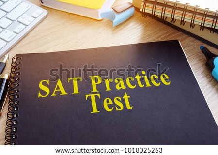 SAT Practice Tests with textbooks on a desk. Stock fotó © 