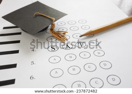 SAT test with pencil and mortar board graduation cap                                Stock fotó © 